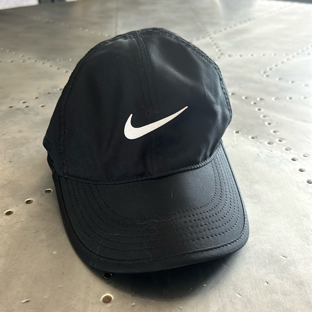 Nike featherlight dry-fit women’s hat. Seems to run small.